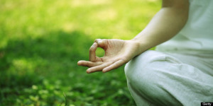 young woman doing yoga,hand close-up